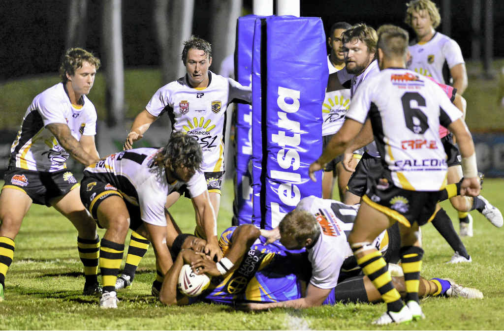 Gerald Tema is wrapped up in a tackle. Gerald Tema is wrapped up in a tackle.