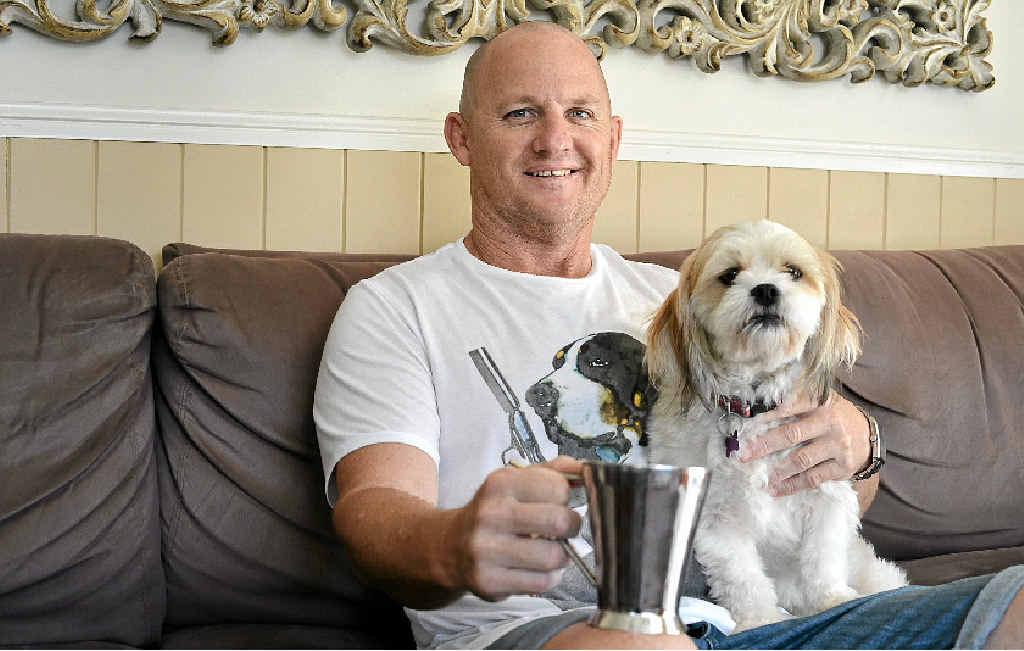 SOUND ADVICE: Former rugby league player Kerrod Walters at home with his dog, Bella, is promoting health checks following his open heart surgery. SOUND ADVICE: Former rugby league player Kerrod Walters at home with his dog, Bella, is promoting health checks following his open heart surgery.