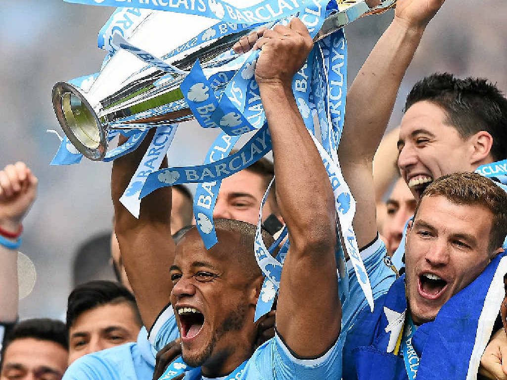 CHAMPIONS: Manchester City captain Vincent Kompany lifts the English Premier League trophy. CHAMPIONS: Manchester City captain Vincent Kompany lifts the English Premier League trophy.
