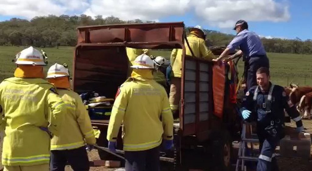 Emergency services work to free Edwin Metzroth from a cattle feeding machine on his Nobby property. Emergency services work to free Edwin Metzroth from a cattle feeding machine on his Nobby property.