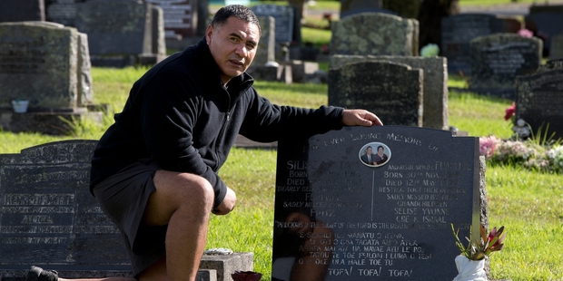 Selise Lo Tam at his grandparents' grave at Waikumete Cemetery where his father, Fritz Lo Tam, died on Mother's Day. Photo / Brett Phibbs Selise Lo Tam at his grandparents' grave at Waikumete Cemetery where his father, Fritz Lo Tam, died on Mother's Day. Photo / Brett Phibbs