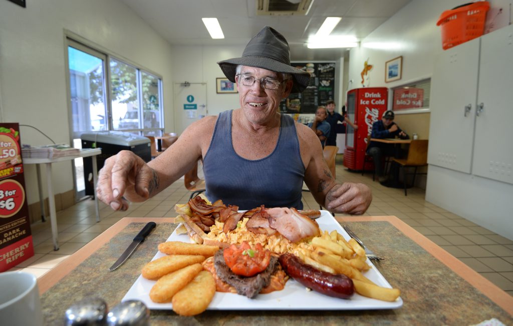 Truckie Glenn Pauling attempts the $39.95 big breakfast at the Yaamba Road Caltex service station. Photo: Chris Ison / The Morning Bulletin Truckie Glenn Pauling attempts the $39.95 big breakfast at the Yaamba Road Caltex service station. Photo: Chris Ison / The Morning Bulletin