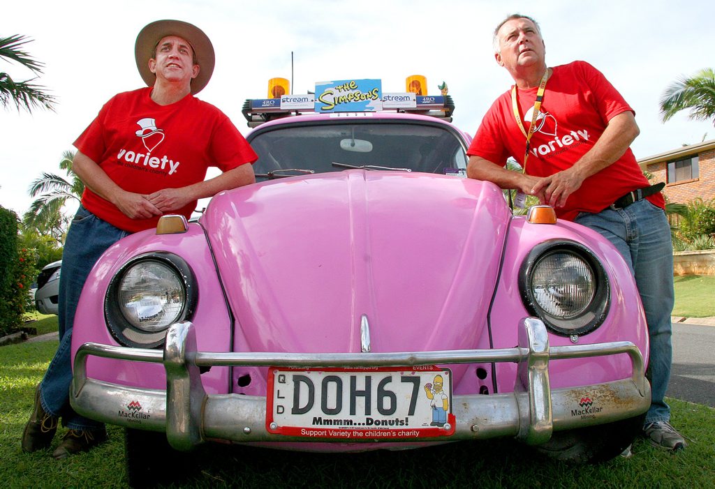 Image for sale: DRIVING MOTIVATION: Yeppoon's David Murray (left) and Greg Wilson ponder the 4000km journey ahead in their bright pink, stretched 1967 VW Beetle as part of the 25th anniversary Variety Bash in August.