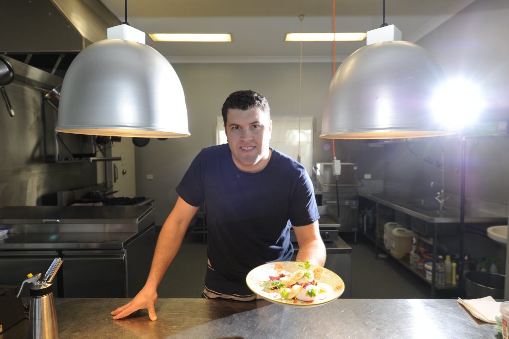 CULINARY ADVENTURE: Chef Nathan Earp at Austin & Co with a dish made from fresh, local produce. Photo JoJo Newby / The Daily Examiner CULINARY ADVENTURE: Chef Nathan Earp at Austin & Co with a dish made from fresh, local produce. Photo JoJo Newby / The Daily Examiner