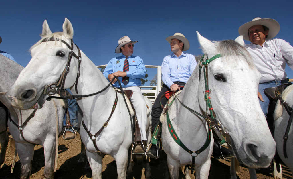 Opposition Leader Tony Abbott on horseback flanked by Cattlemen Graeme Acton and Cameron McIntyre at Acton’s property Paradise Lagoons outside Rockhampton. Opposition Leader Tony Abbott on horseback flanked by Cattlemen Graeme Acton and Cameron McIntyre at Acton’s property Paradise Lagoons outside Rockhampton.