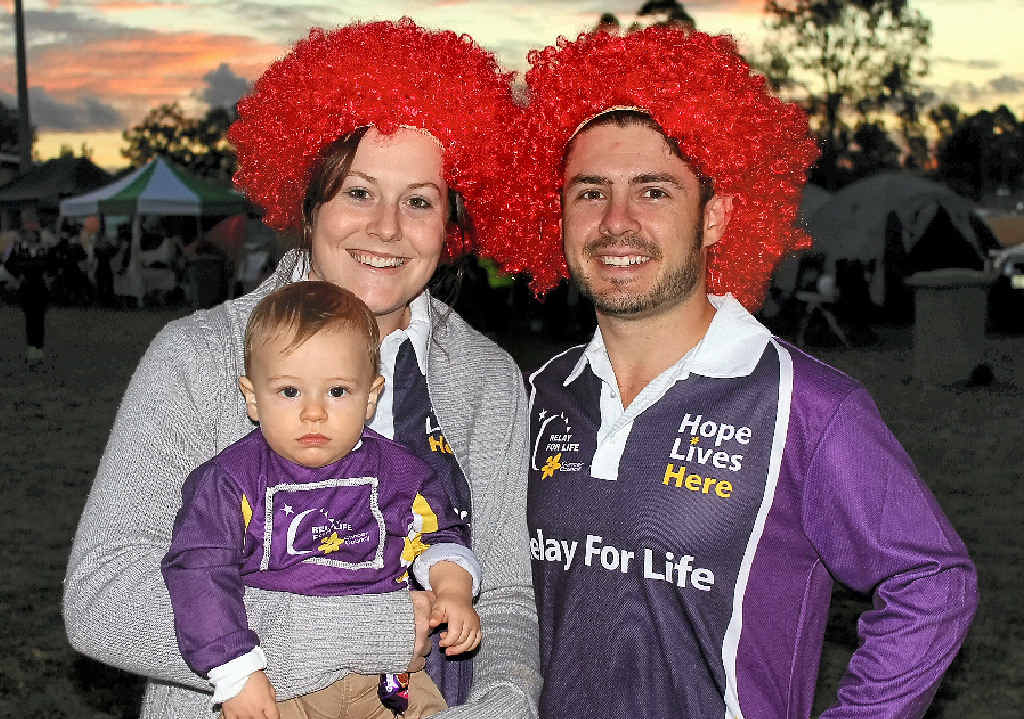 REMEMBERING DAD: Jess Quinn, James McDonald and Adrian McDonald at the 2014 Lockyer Valley Relay for Life. All three were part of team The Mighty Quinn, in memory of Jess’s dad Gary Quinn who passed away from cancer last year. Adrian lit the future candle during the relay for his son James, as the face of the future. REMEMBERING DAD: Jess Quinn, James McDonald and Adrian McDonald at the 2014 Lockyer Valley Relay for Life. All three were part of team The Mighty Quinn, in memory of Jess’s dad Gary Quinn who passed away from cancer last year. Adrian lit the future candle during the relay for his son James, as the face of the future.