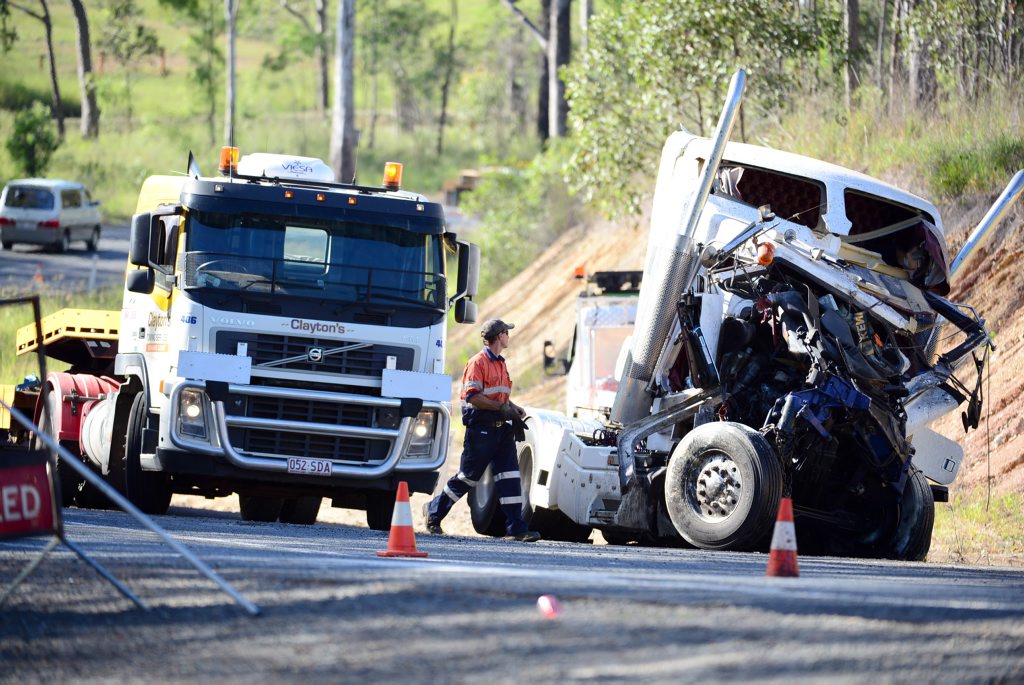 Police and emergency services attend the scene of a serious crash involving two trucks north of Gin Gin on the Bruce Highway. Police and emergency services attend the scene of a serious crash involving two trucks north of Gin Gin on the Bruce Highway.