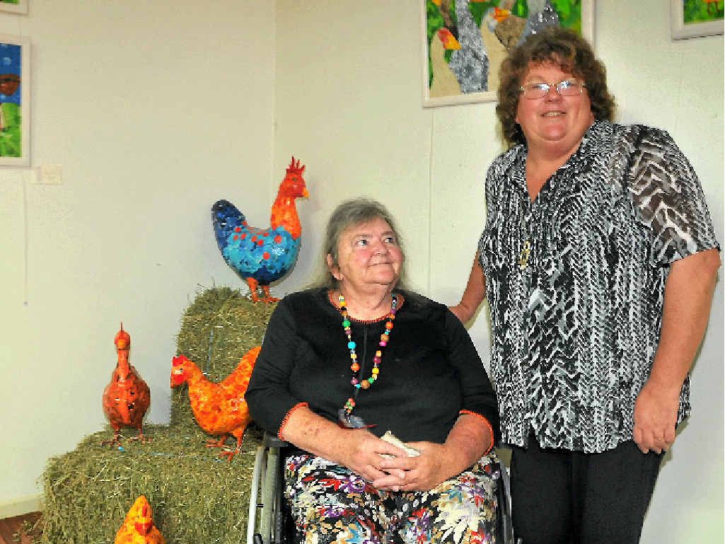 SPECIAL: Valerie Herzog and Sue Daw with some of Sue’s papier mâché chooks. SPECIAL: Valerie Herzog and Sue Daw with some of Sue’s papier mâché chooks.