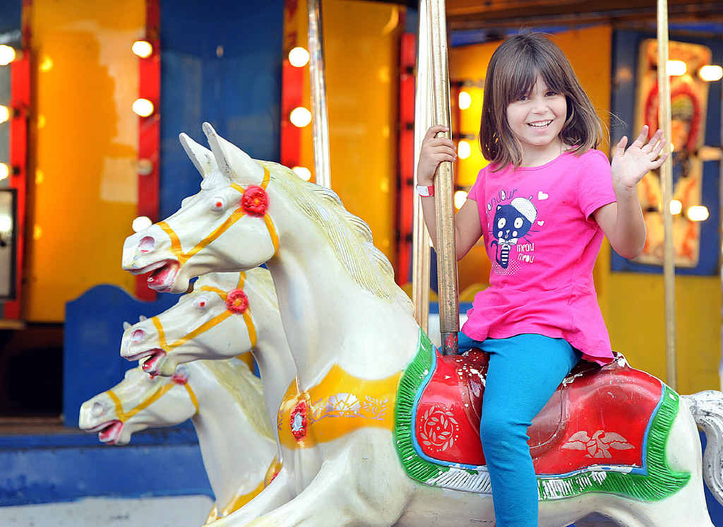 Jessica Staples, 5, from Toogoom is all smiles as she takes her first ever ride on a merry-go-round. Jessica Staples, 5, from Toogoom is all smiles as she takes her first ever ride on a merry-go-round.