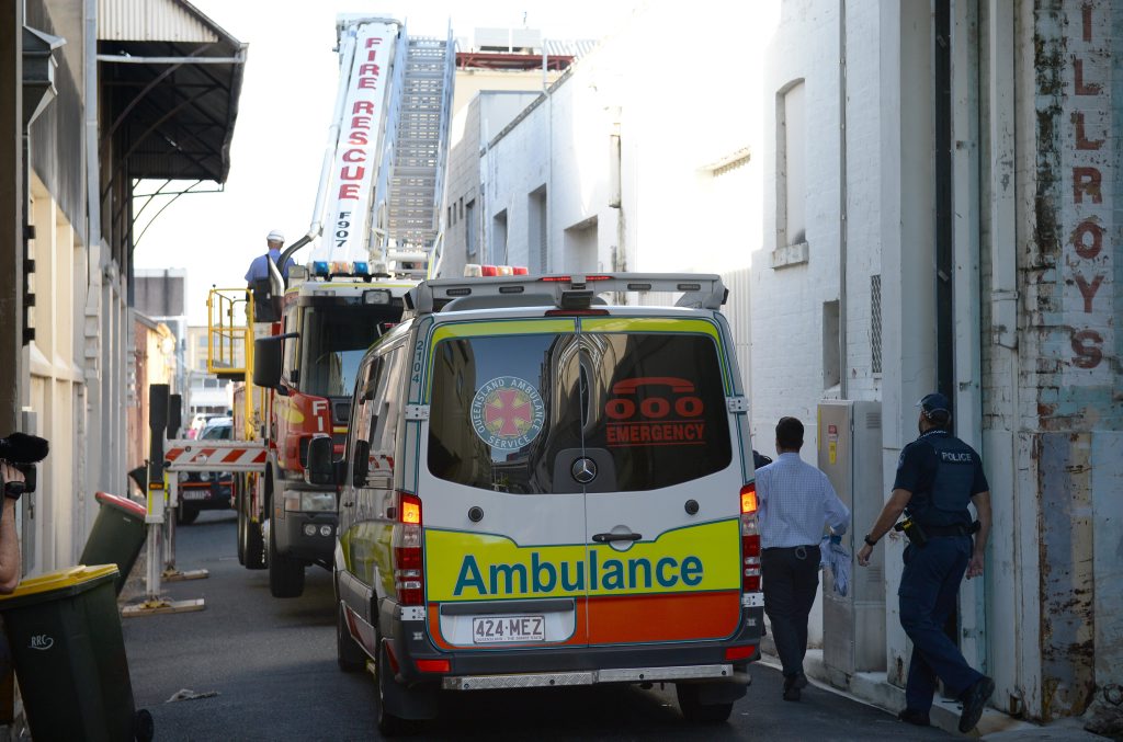 Police, fire fighter and ambulance officers were called to rescue a man from a rooftop on Quay Lane. Photo: Chris Ison / The Morning Bulletin Police, fire fighter and ambulance officers were called to rescue a man from a rooftop on Quay Lane. Photo: Chris Ison / The Morning Bulletin