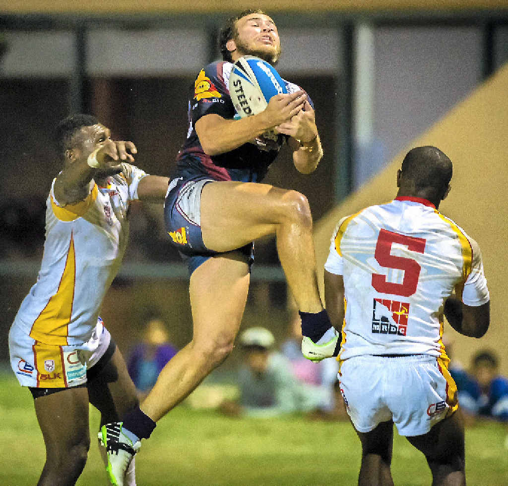 CQ Capras’ player Reece Baker claims a high ball against a determined PNG Hunters side during their match at Marley Brown Oval in Gladstone. CQ Capras’ player Reece Baker claims a high ball against a determined PNG Hunters side during their match at Marley Brown Oval in Gladstone.