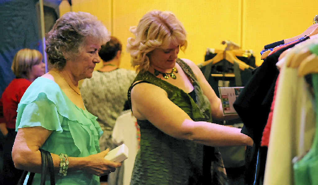 Fashion-savvy women survey some of the many garments for purchase at Style Me Up at the Gladstone Entertainment and Convention Centre. Fashion-savvy women survey some of the many garments for purchase at Style Me Up at the Gladstone Entertainment and Convention Centre.