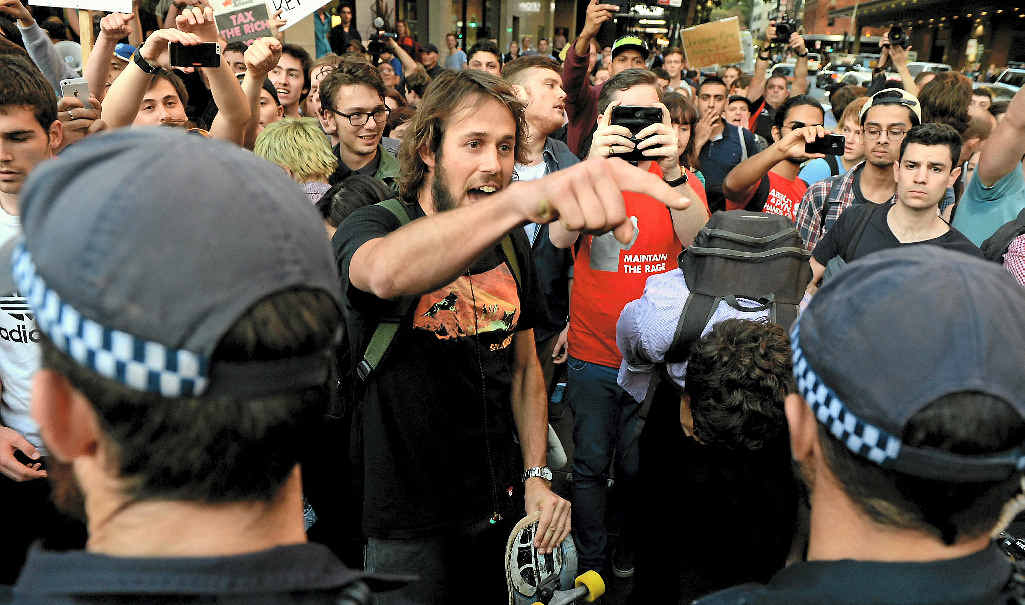 OUTRAGE: Protesters are pushed back by police as thousands of university students from the University of Sydney and UTS march through the CBD against the Abbott Government’s budget measures last week. OUTRAGE: Protesters are pushed back by police as thousands of university students from the University of Sydney and UTS march through the CBD against the Abbott Government’s budget measures last week.