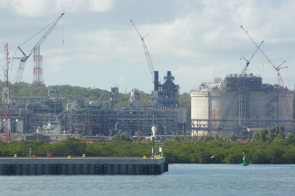 The QCLNG site, including tanks and trains, as seen from the quarterly construction cruise on Gladstone harbour. The QCLNG site, including tanks and trains, as seen from the quarterly construction cruise on Gladstone harbour.