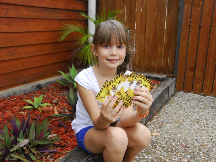 Paige Munn, 7, loves The Observer's Dinosaur Collector Card series.
