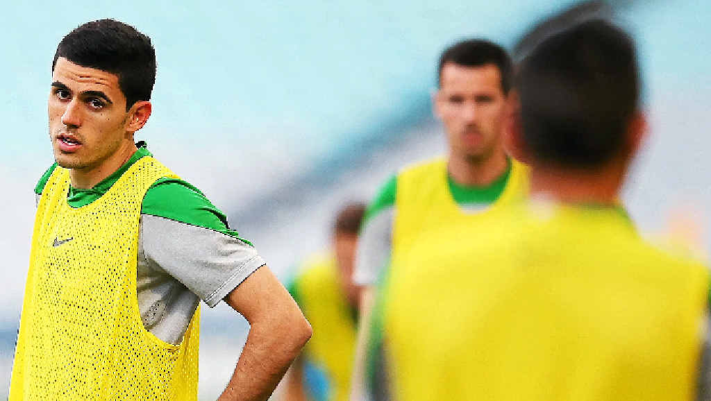 SQUAD CUTS: Socceroo Tom Rogic (left) looks on during a recent training session. The midfielder is under an injury cloud because of a groin strain but is expected to be fit for the World Cup unlike defender Curtis Good (inset) who has been ruled out with a hip flexor injury. SQUAD CUTS: Socceroo Tom Rogic (left) looks on during a recent training session. The midfielder is under an injury cloud because of a groin strain but is expected to be fit for the World Cup unlike defender Curtis Good (inset) who has been ruled out with a hip flexor injury.