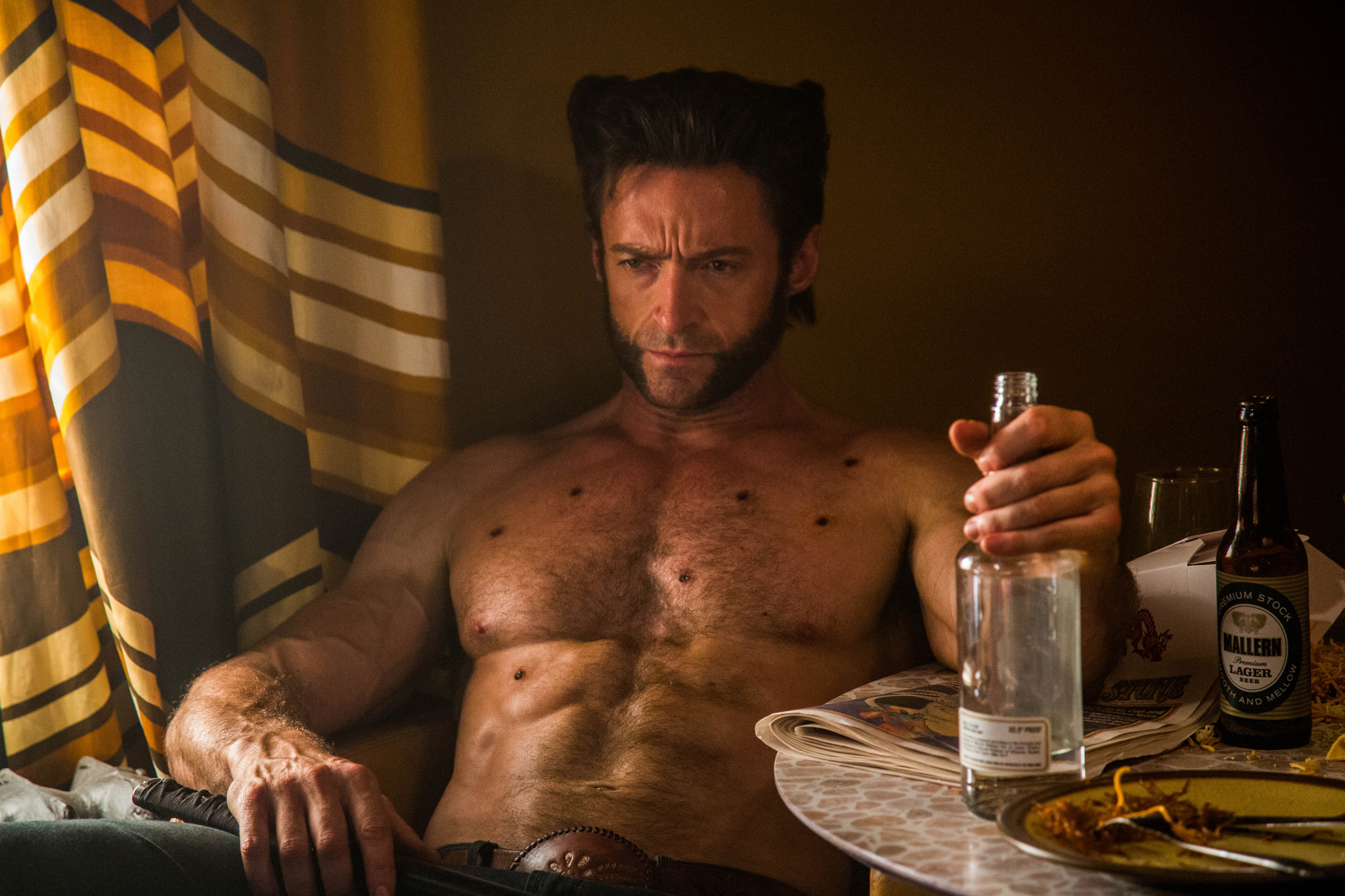 Hugh Jackman as Wolverine nurses his wounds in X-Men: Days of Future Past Hugh Jackman as Wolverine nurses his wounds in X-Men: Days of Future Past