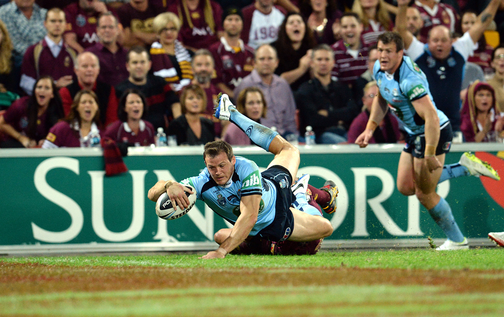 NSW Blues player Brett Morris scores a try against Queensland during Game one of the 2014 State of Origin rugby league series at Suncorp Stadium in Brisbane, Wednesday, May 28, 2014. NSW Blues player Brett Morris scores a try against Queensland during Game one of the 2014 State of Origin rugby league series at Suncorp Stadium in Brisbane, Wednesday, May 28, 2014.