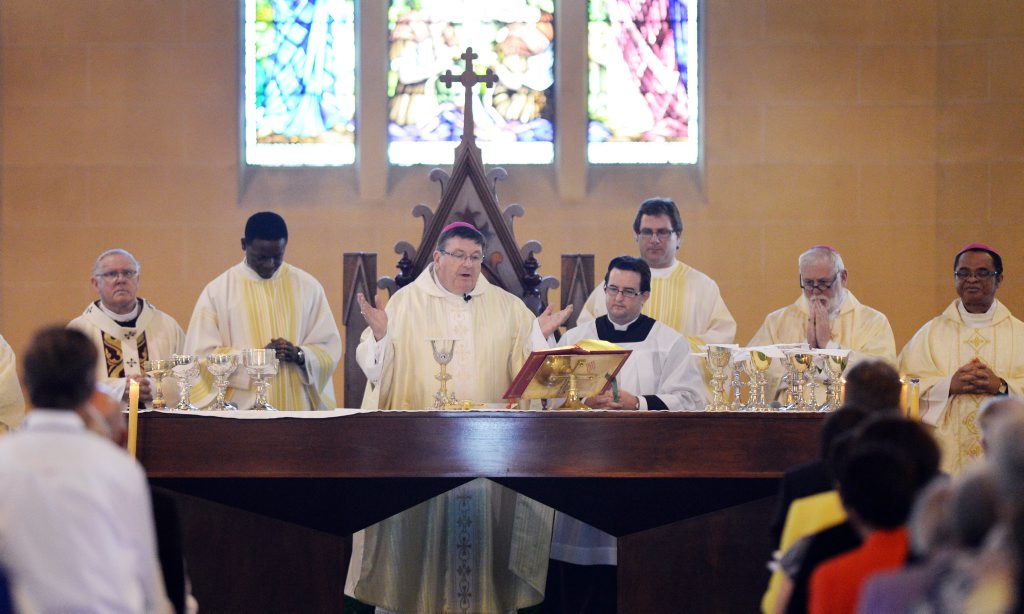 Bishop Michael McCarthy hosting communion at his Ordination Ceremony at St' Joseph's Cathedral in Rockhampton. Photo: Chris Ison / The Morning Bulletin