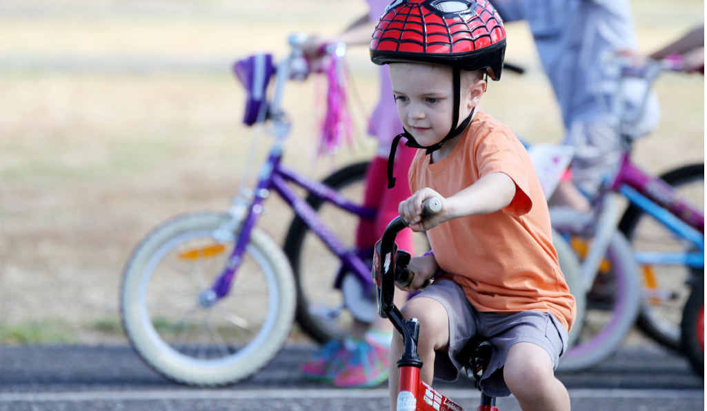 BUCKLE UP: Local children hit the bitumen for a bicycle safety workshop. BUCKLE UP: Local children hit the bitumen for a bicycle safety workshop.