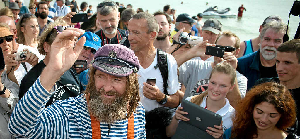 UNFAMILIAR NOISE: Mr Konyukhov was taken aback by the noise of the crowd after so many quiet months at sea. UNFAMILIAR NOISE: Mr Konyukhov was taken aback by the noise of the crowd after so many quiet months at sea.