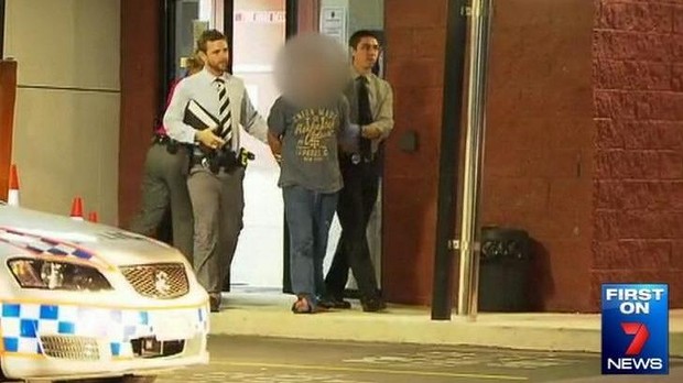 The man accused of trying to snatch a toddler from a Brisbane shopping centre leaves Stafford police station in handcuffs. Photo: Seven News
The man accused of trying to snatch a toddler from a Brisbane shopping centre leaves Stafford police station in handcuffs. Photo: Seven News