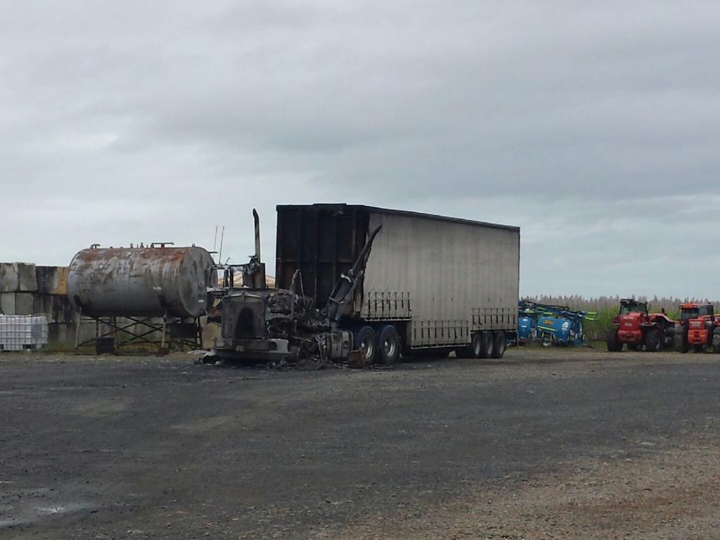 One of the trucks which has been destroyed by fire. One of the trucks which has been destroyed by fire.