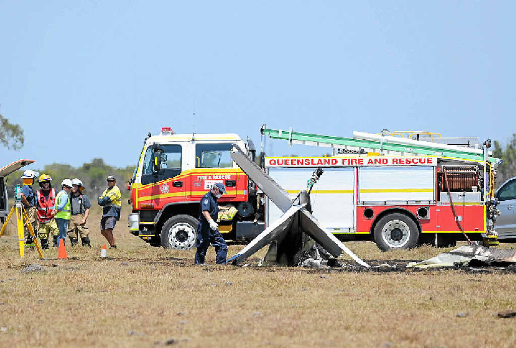 FATAL CRASH: Emergency workers at the scene of the plane crash in a paddock opposite Flame Lily Adventure Park at Burrum Heads in which Gympie pilot Mike Oulton was killed. FATAL CRASH: Emergency workers at the scene of the plane crash in a paddock opposite Flame Lily Adventure Park at Burrum Heads in which Gympie pilot Mike Oulton was killed.