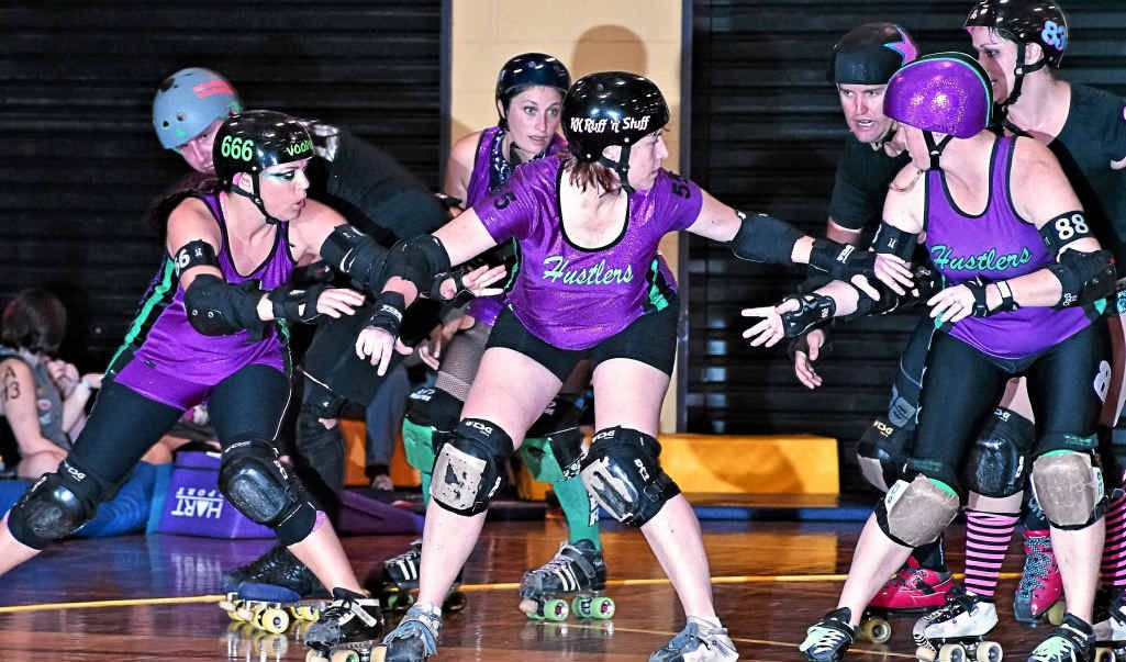 IN ACTION: Hustlers’ Voodoo Vixen, KK Ruff N Stuff and Zerky provide strong defence. IN ACTION: Hustlers’ Voodoo Vixen, KK Ruff N Stuff and Zerky provide strong defence.