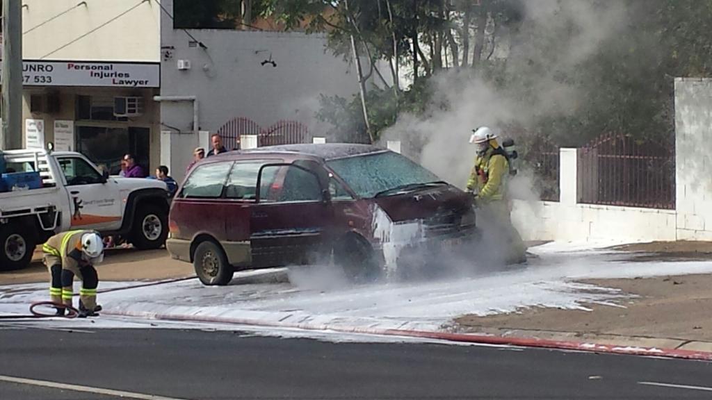 Emergency services extinguish a car on fire at the intersection of Herries and Kitchener Sts. Emergency services extinguish a car on fire at the intersection of Herries and Kitchener Sts.