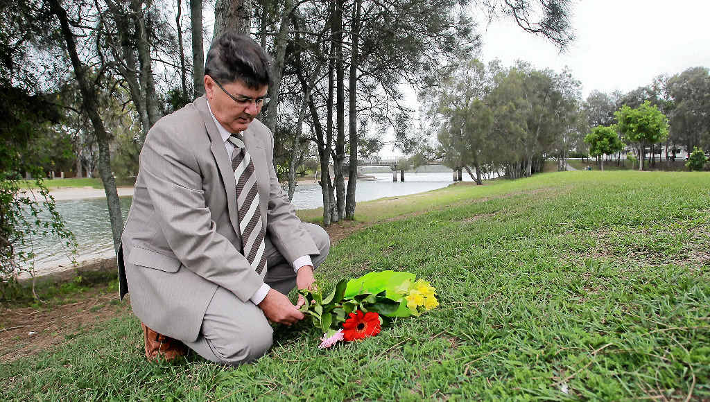 LIVING IN HOPE: Dwayne Cunningham places flowers in the park at Picnic Point where he believes his mother Deirdre might have been on the night she disappeared. LIVING IN HOPE: Dwayne Cunningham places flowers in the park at Picnic Point where he believes his mother Deirdre might have been on the night she disappeared.