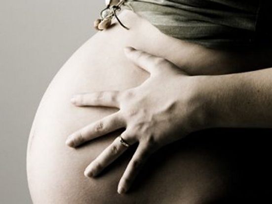 A pregnant woman. A pregnant woman.