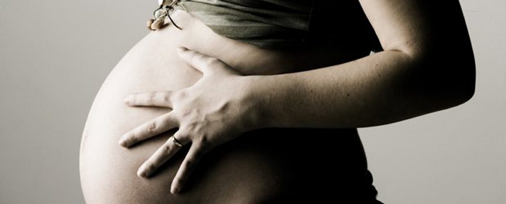 A pregnant woman. A pregnant woman.