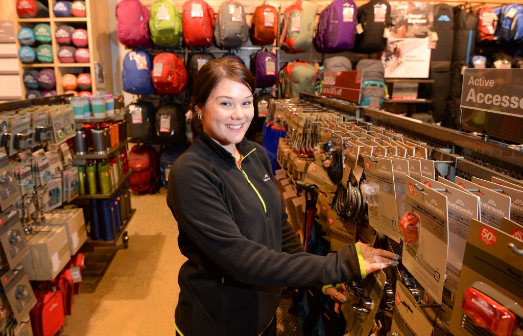 Kathmandu store manager Kylie Stoch arranges stock in the new store at Stockland Rockhampton. Photo: Chris Ison / The Morning Bulletin Kathmandu store manager Kylie Stoch arranges stock in the new store at Stockland Rockhampton. Photo: Chris Ison / The Morning Bulletin