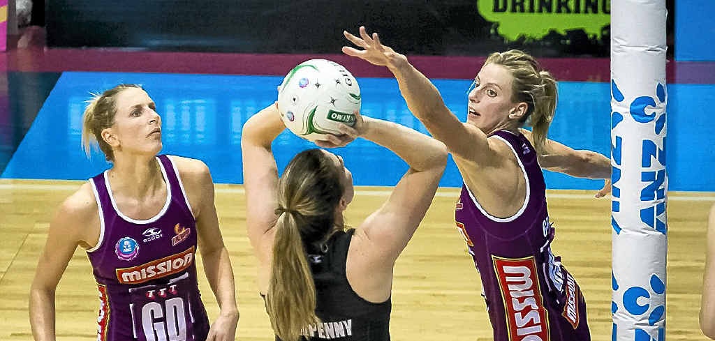 Clare McMeniman (left) and Laura Geitz (right) in defence for the Queensland Firebirds. Clare McMeniman (left) and Laura Geitz (right) in defence for the Queensland Firebirds.