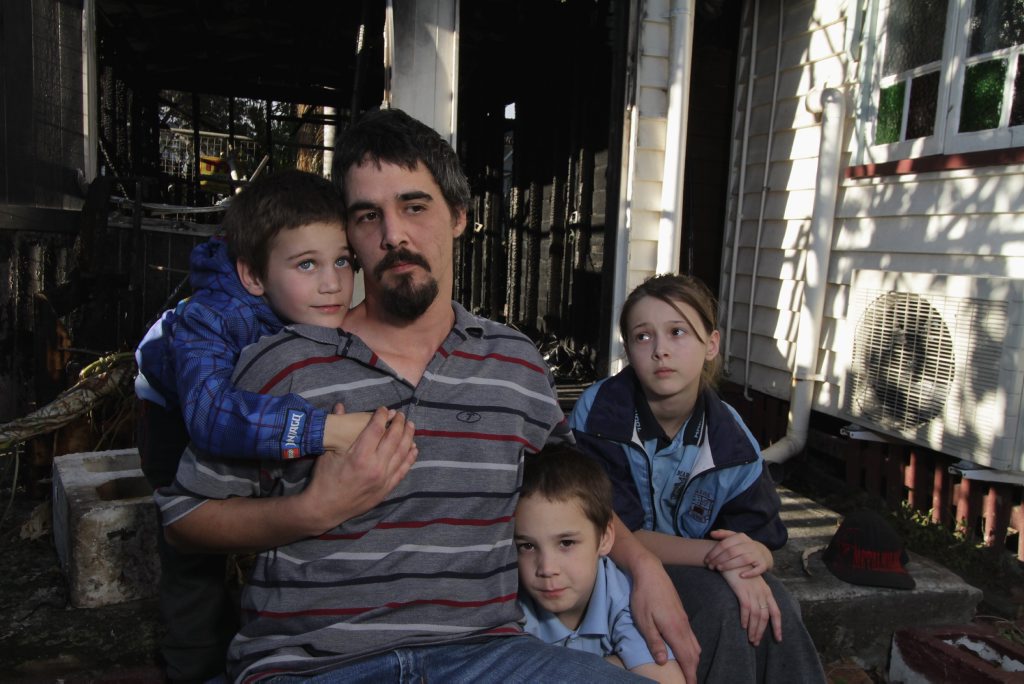 Baden Braghetto with his children Lydia, 13, Campbell, 8, and Declan, 6, lost everything when a fire destroyed the shed they were practically living in. Baden Braghetto with his children Lydia, 13, Campbell, 8, and Declan, 6, lost everything when a fire destroyed the shed they were practically living in.
