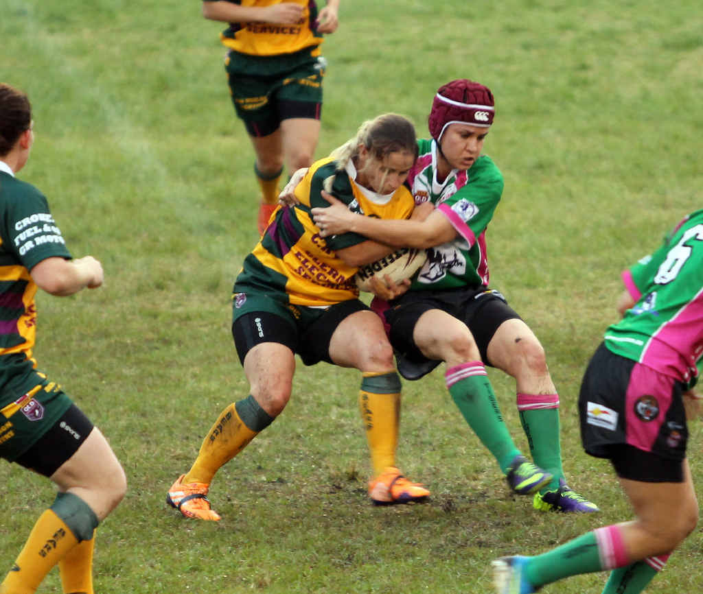 GRUDGE MATCH: Emerald Tigers’ Renee Hogan takes down a Clermont player. GRUDGE MATCH: Emerald Tigers’ Renee Hogan takes down a Clermont player.