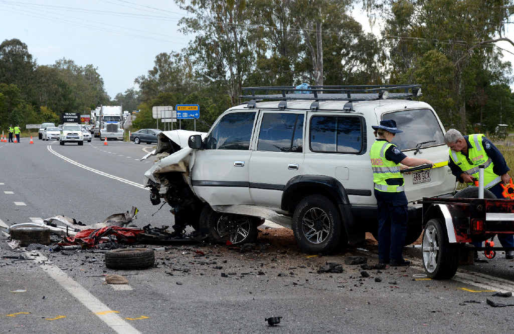 HORROR: Police investigators look over the scene of a head-on collision on the Bruce Hwy on Sunday. An 83-year-old driver of a Hyundai i20 died instantly. HORROR: Police investigators look over the scene of a head-on collision on the Bruce Hwy on Sunday. An 83-year-old driver of a Hyundai i20 died instantly.