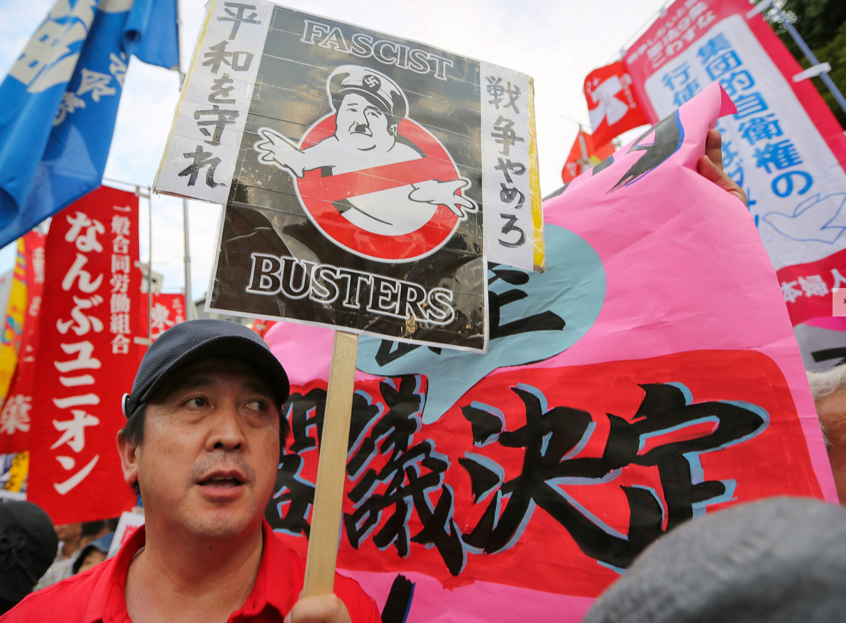 PROTESTORS with anti-war placards hold a mass rally outside the Prime Minister's office in Tokyo PROTESTORS with anti-war placards hold a mass rally outside the Prime Minister's office in Tokyo