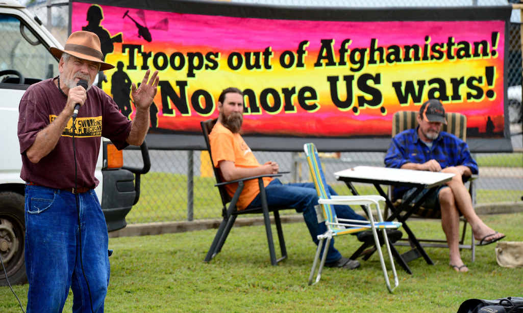 HEAR THIS: Peace activist Graeme Dunstan delivers his message during a public speakout outside the army barracks in Rockhampton. HEAR THIS: Peace activist Graeme Dunstan delivers his message during a public speakout outside the army barracks in Rockhampton.