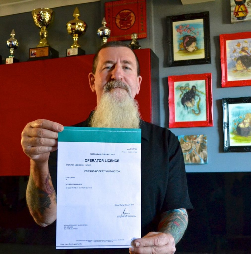 Sink the Ink Tattooz owner Ted Saddo (Edward Saddington) is one of only three tattoo studio owners to receive a licence to operate under Queensland’s new anti-bikie gang laws. Sink the Ink Tattooz owner Ted Saddo (Edward Saddington) is one of only three tattoo studio owners to receive a licence to operate under Queensland’s new anti-bikie gang laws.