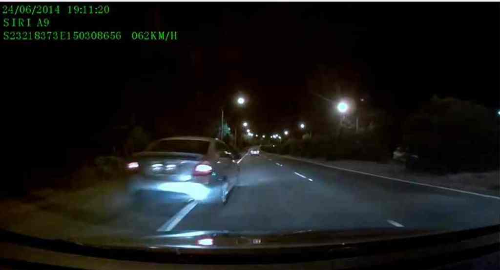 A dashcam captures a car overtaking it by going on the left side, near Rockhampton Airport A dashcam captures a car overtaking it by going on the left side, near Rockhampton Airport