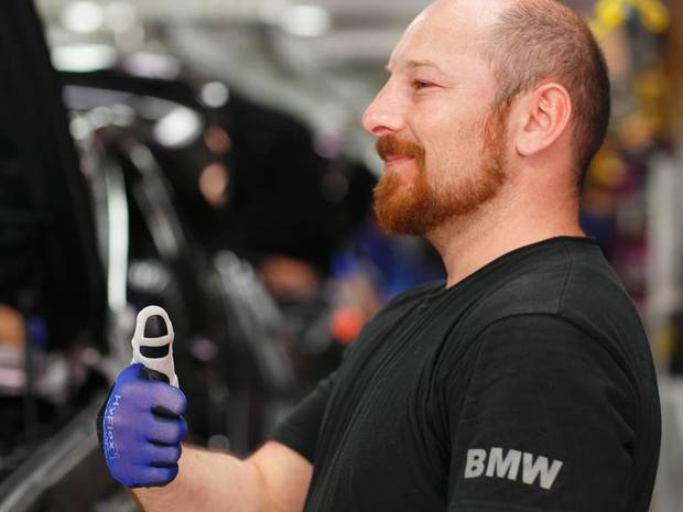 The thumb-guard is made from a hybrid material that stiffens when straightened, allowing workers to assemble cars with less strain. The thumb-guard is made from a hybrid material that stiffens when straightened, allowing workers to assemble cars with less strain.
