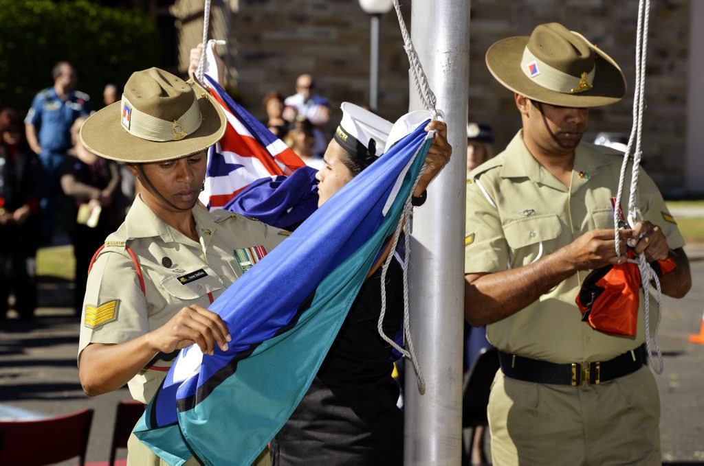 Sergeant Anne Dufficy, Cadet Seaman Tegan Weise and Lance Bombardier John Murphy raise the Torres Strait Islander, Australian and Aboriginal flags during the Yamanto Police station Naidoc Week flag raising ceremony. Photo: Claudia Baxter / The Queensland Times Sergeant Anne Dufficy, Cadet Seaman Tegan Weise and Lance Bombardier John Murphy raise the Torres Strait Islander, Australian and Aboriginal flags during the Yamanto Police station Naidoc Week flag raising ceremony. Photo: Claudia Baxter / The Queensland Times