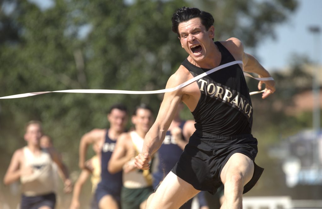 Jack O'Connell in a scene from the movie Unbroken. Jack O'Connell in a scene from the movie Unbroken.