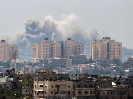 Smoke billows from buildings following an Israeli air strike in Gaza City Smoke billows from buildings following an Israeli air strike in Gaza City