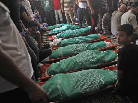 Relatives and friends of al-Hajj family gather in a mosque to pray over the bodies of the eight family members Relatives and friends of al-Hajj family gather in a mosque to pray over the bodies of the eight family members