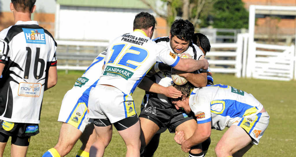 WRAPPED UP: Magpies debutant Ben Williams has his run stopped by the Murwillumbah Mustangs. WRAPPED UP: Magpies debutant Ben Williams has his run stopped by the Murwillumbah Mustangs.