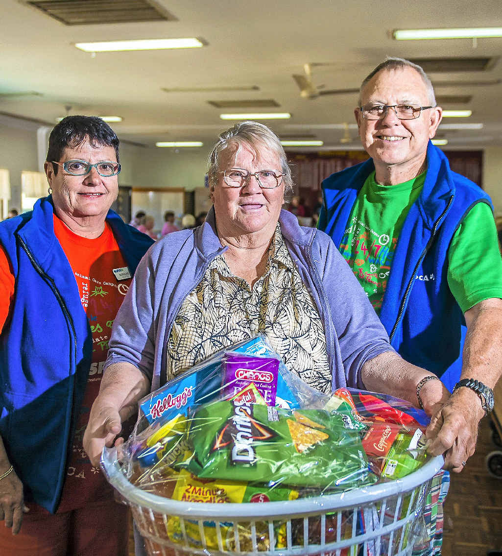 FUNDRAISER: RSPCA volunteers Marianne and Bill O’Reilly present Beverley Heaslip (centre) with a grocery hamper she won at the RSPCA cent sale. FUNDRAISER: RSPCA volunteers Marianne and Bill O’Reilly present Beverley Heaslip (centre) with a grocery hamper she won at the RSPCA cent sale.