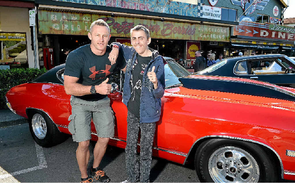 RIDE OF HIS LIFE: Joshua Charrington-Miletic checks out a 1968 Chevelle owned by Scott Hipwell (left) before his trip from Maleny to Palmwoods. RIDE OF HIS LIFE: Joshua Charrington-Miletic checks out a 1968 Chevelle owned by Scott Hipwell (left) before his trip from Maleny to Palmwoods.